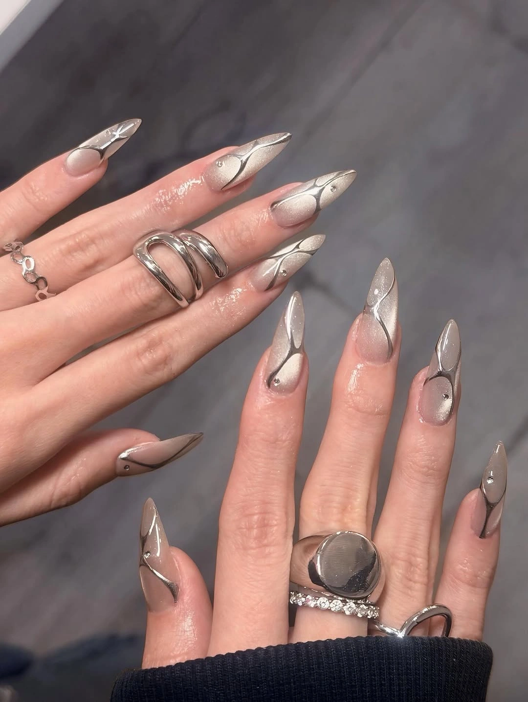 Very long stiletto wedding nails with milky tips and silver detail