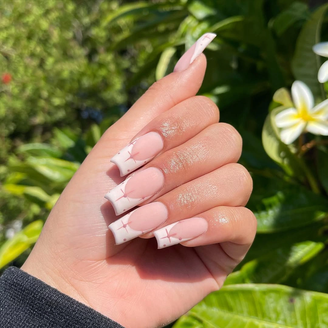 Berry almond wedding nails with gold floral tracing and pink base
