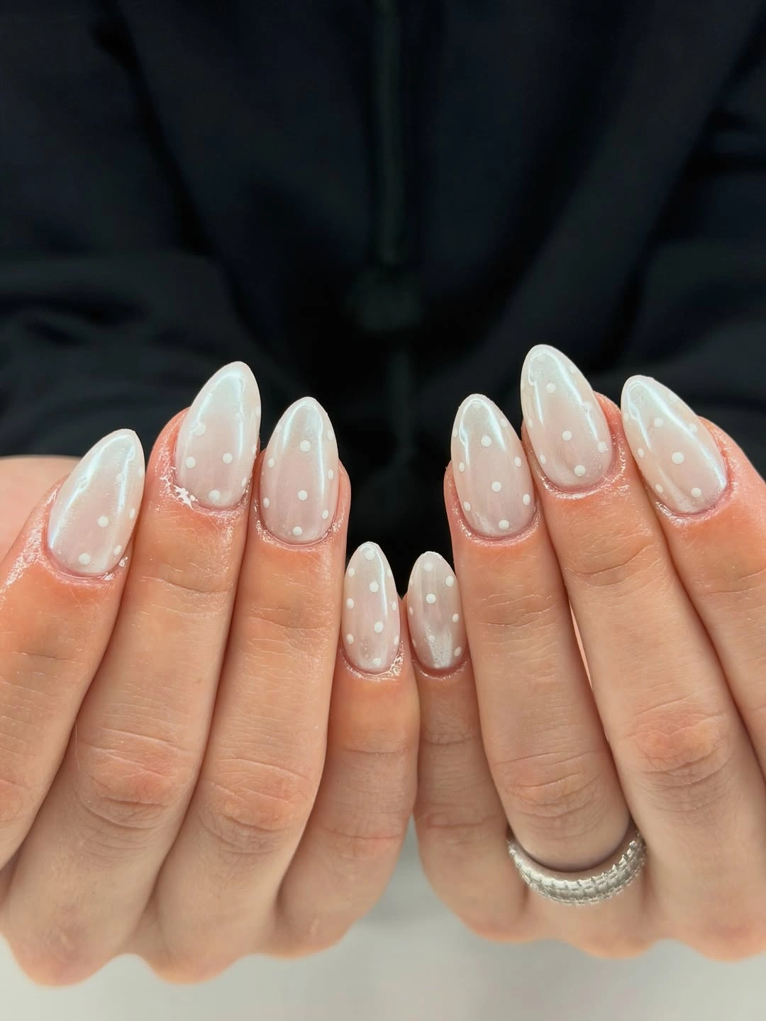 Pearly milky almond wedding nails with soft white French curves