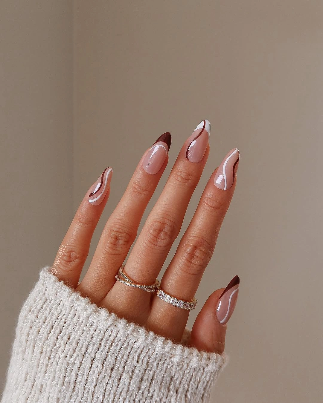 Sheer blush almond wedding nails with pearl shine and silver dots