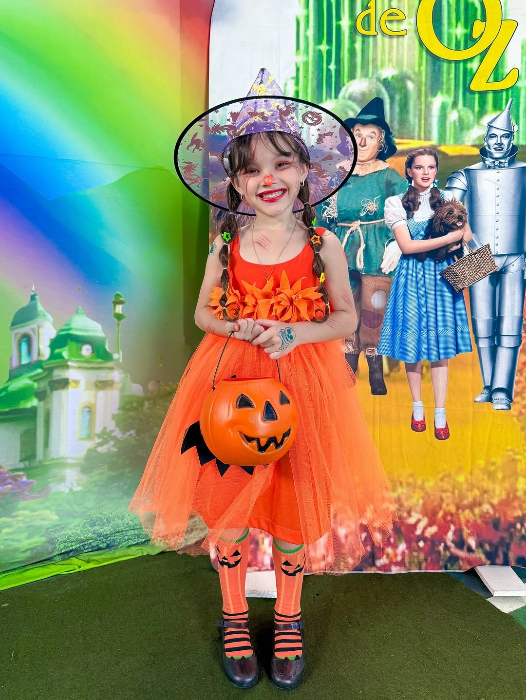 Kids orange pumpkin tutu costume with mini witch hat striped tights and dark shoes