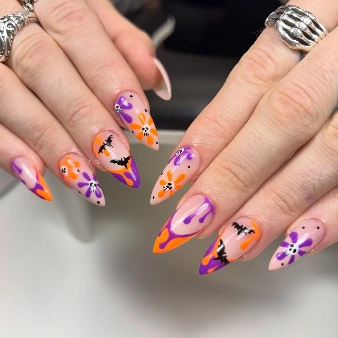 Long almond nails with neon orange purple pink Halloween art