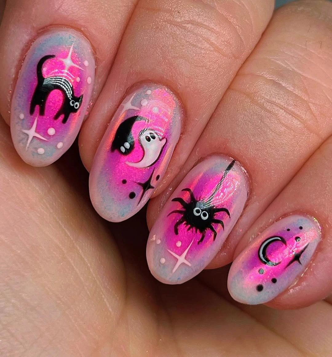 Bright pink oval nails with black cats bats and web details