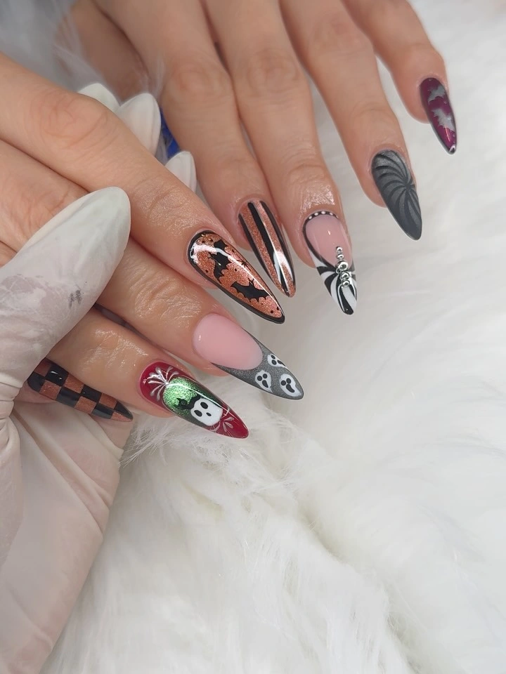 Long almond nails with nude black white red Halloween graphics