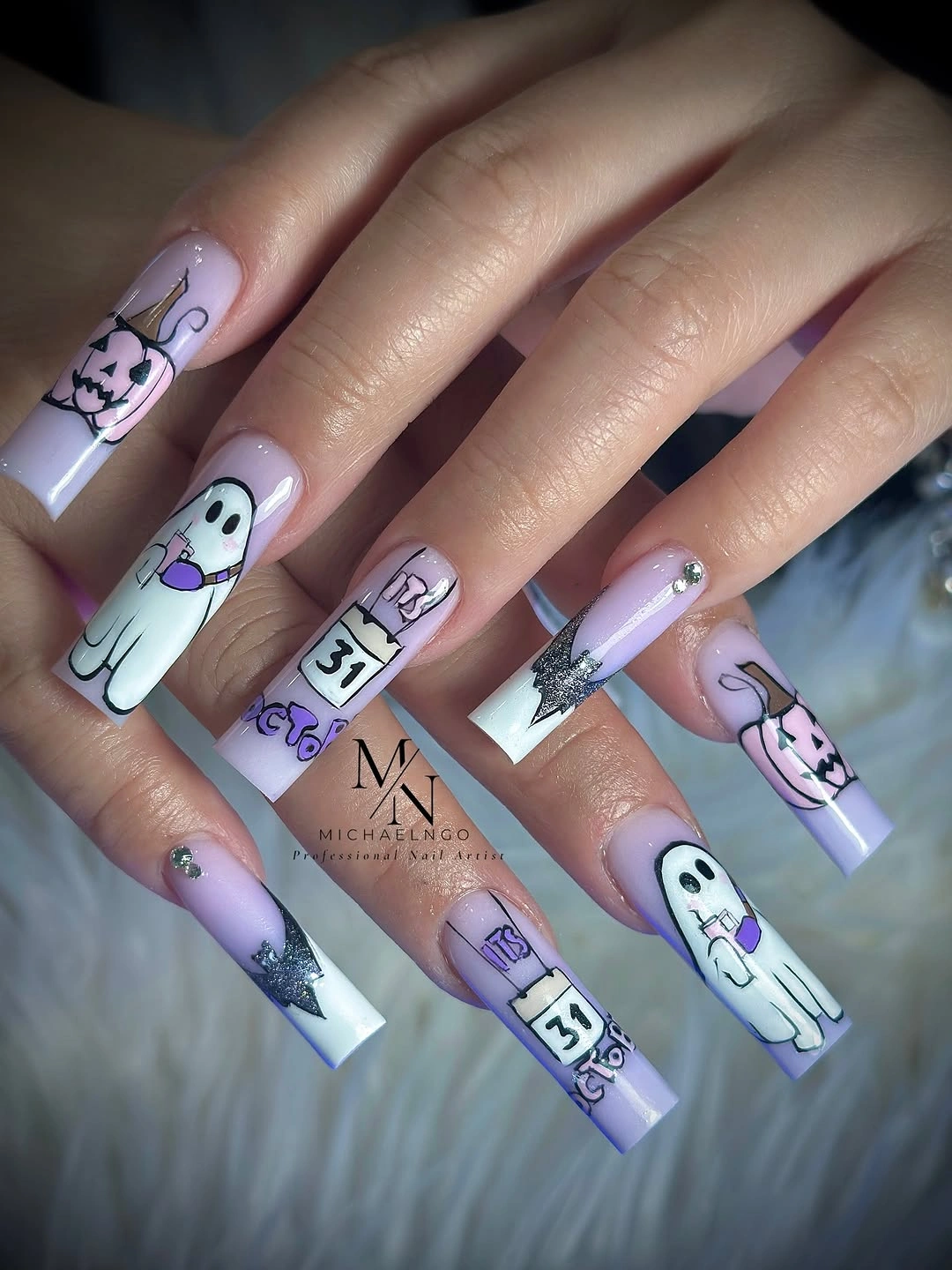 Lavender square nails with white ghosts and dark graphic labels