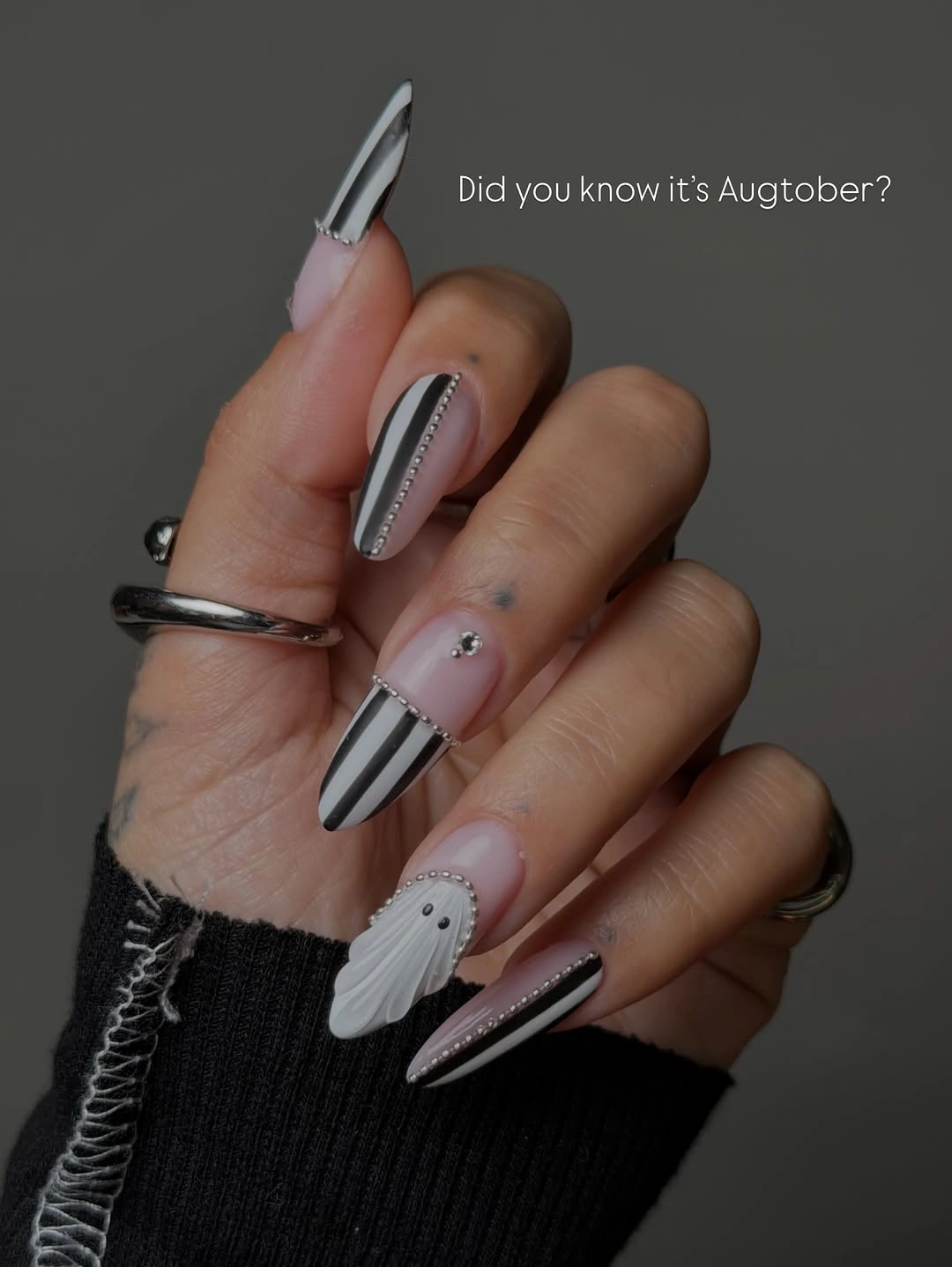 Short mauve nails with dark bands and tiny ghost accent