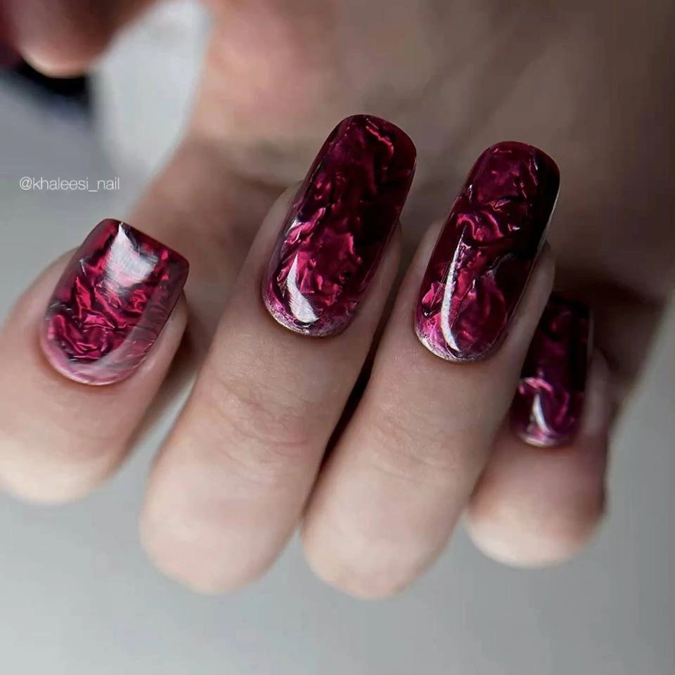 Short square maroon nails with smoky marble and pink streaks