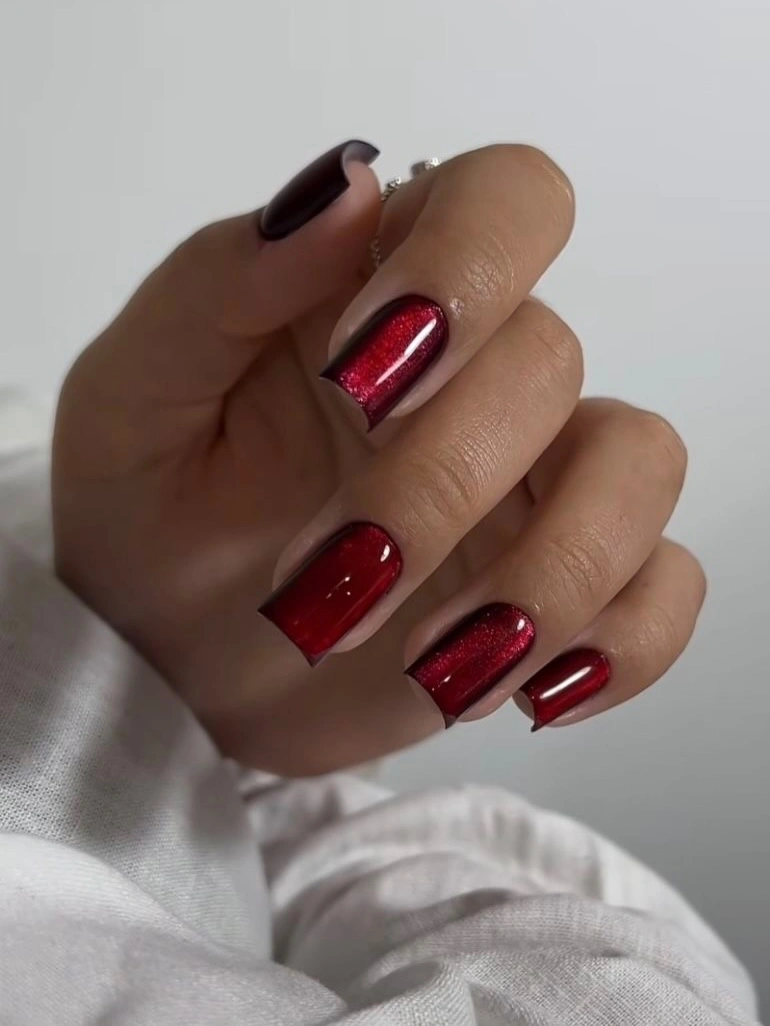 Short square wine nails with restrained glitter and plum accent