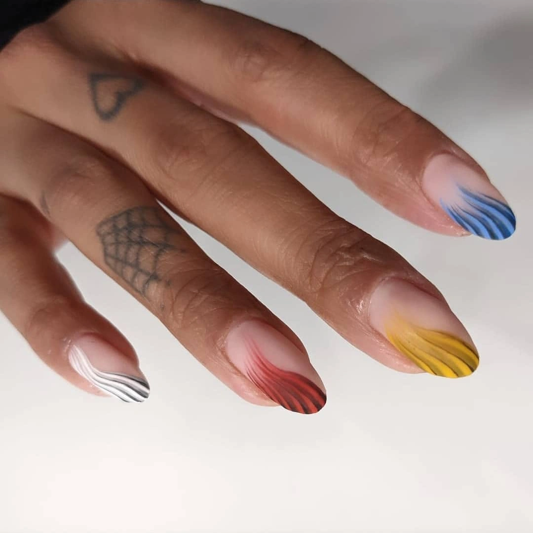 Short almond nails with multicolor pastel wavy French tips
