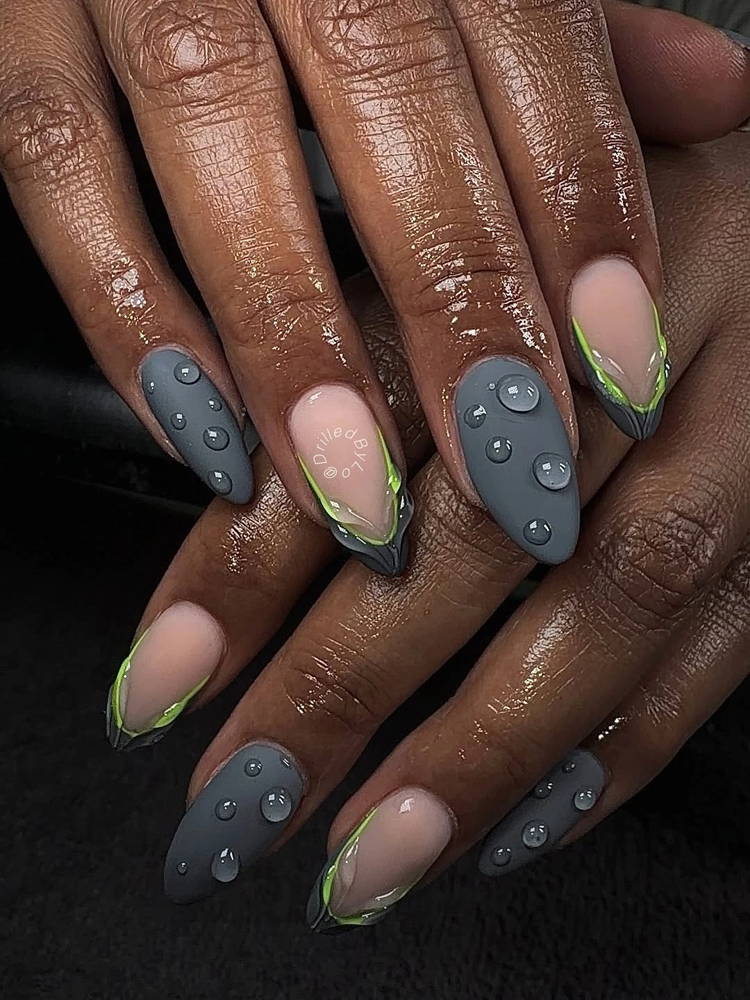 Gray almond nails with lime French details and rounded droplets