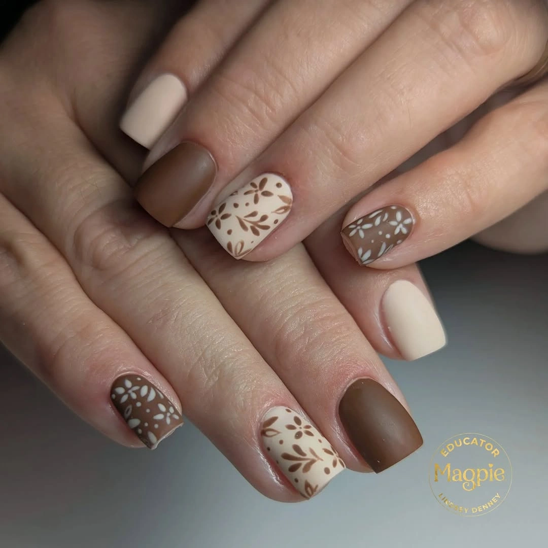 Brown and cream square nails with delicate leaf linework