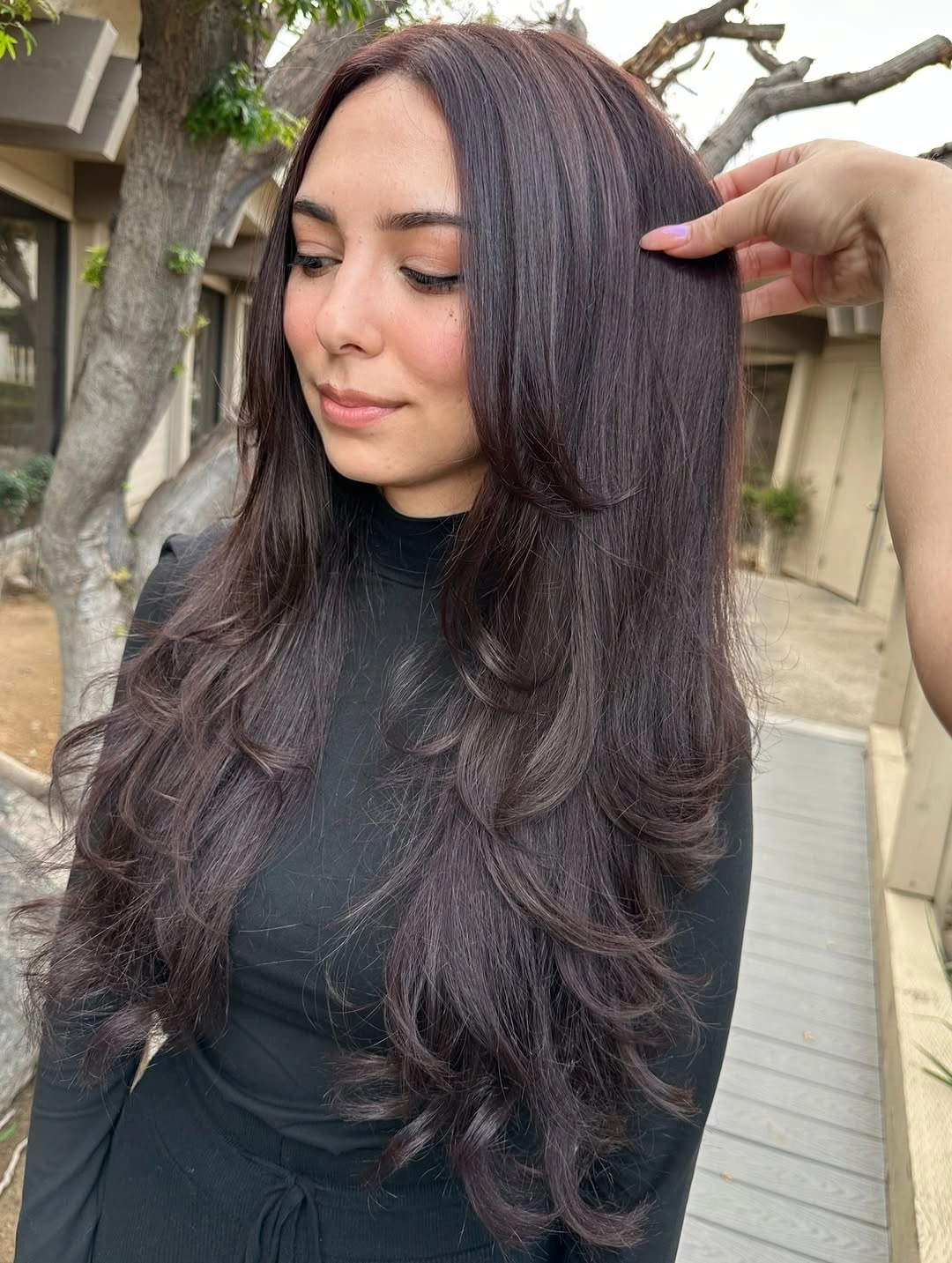 Very long layered middle part hair with face framing waves