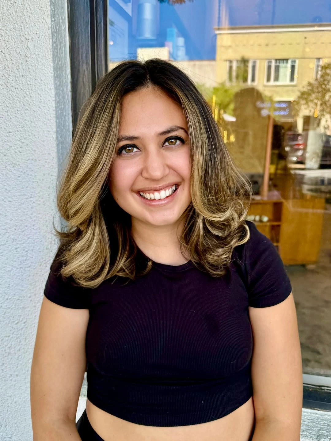 Shoulder length highlighted waves with a clear middle part