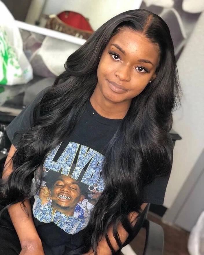 Very long black middle part hair with relaxed lower waves
