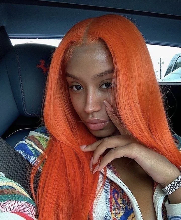 Long vivid orange straight hair with centered middle part