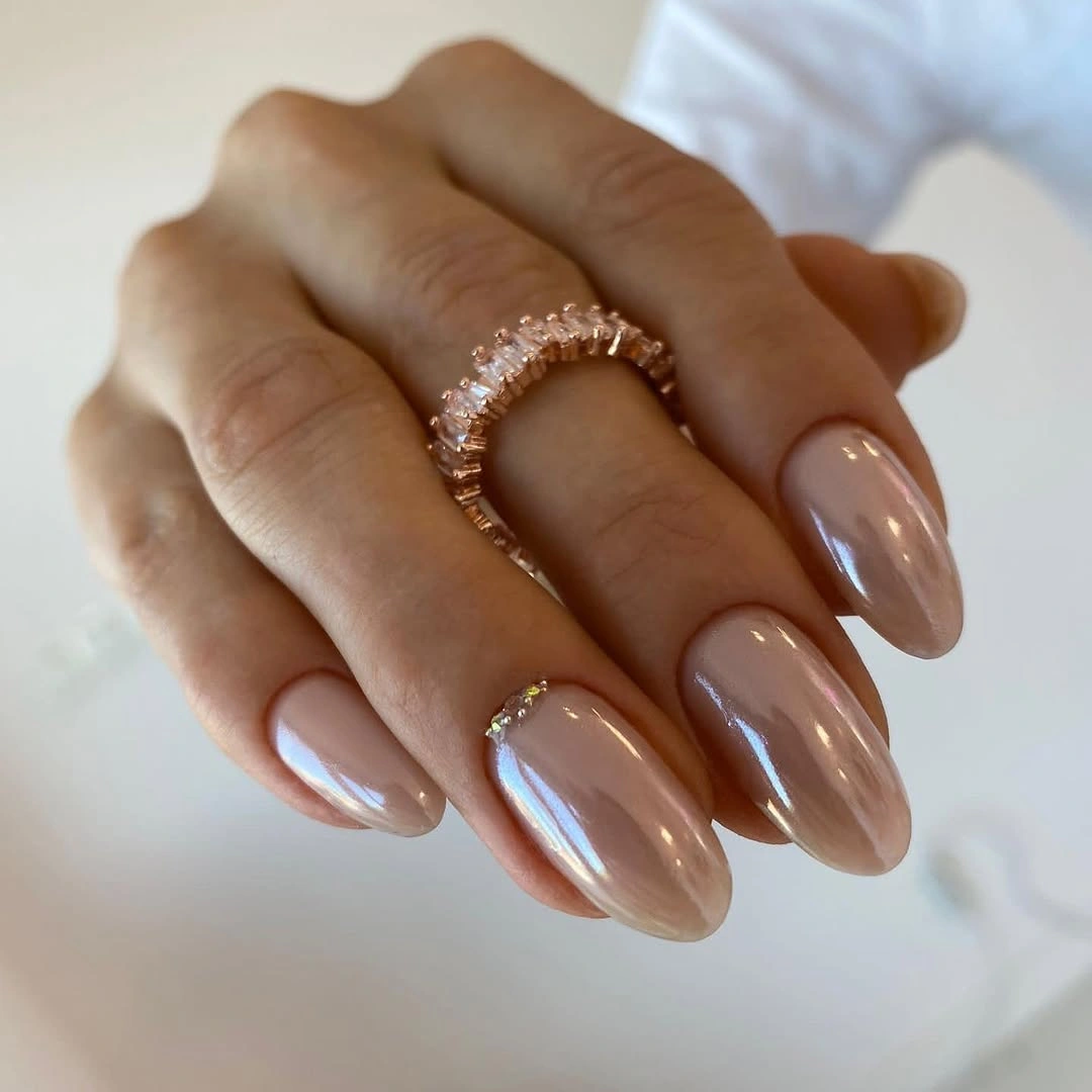 Medium almond nails in smooth warm beige nude color