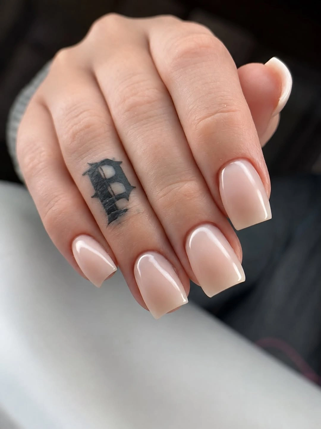 Medium nude pink square nails with slim white contour lines