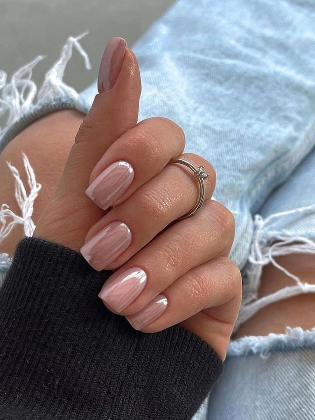 Nude almond nails with soft vertical pink light-catching detail