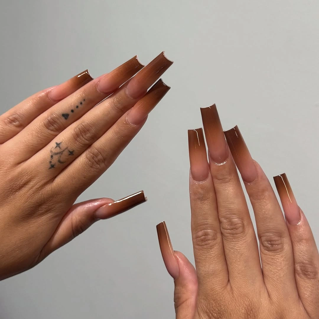 Long square nails fading from warm nude to deep brown tips