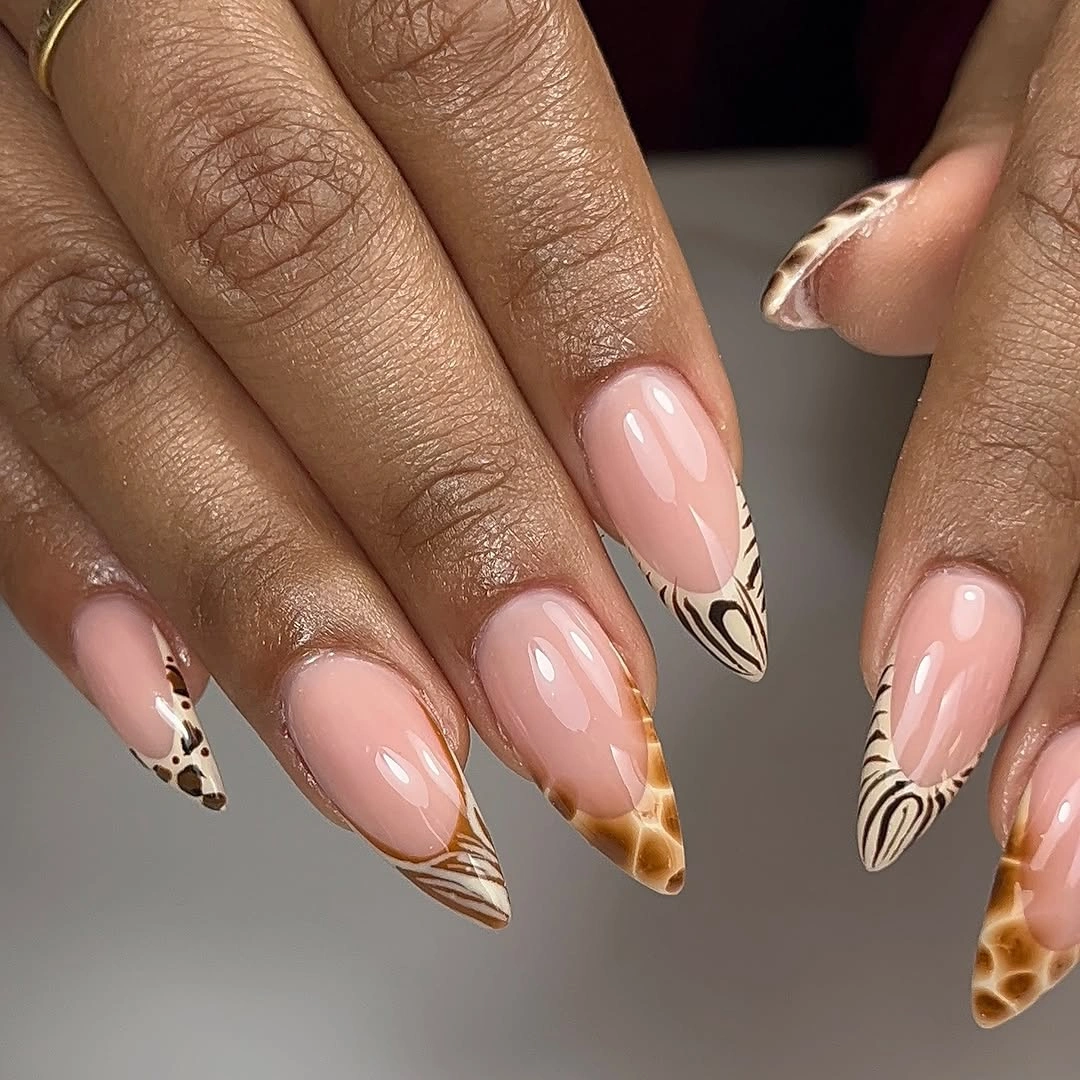 Blush nude almond nails with brown black spotted tip accents