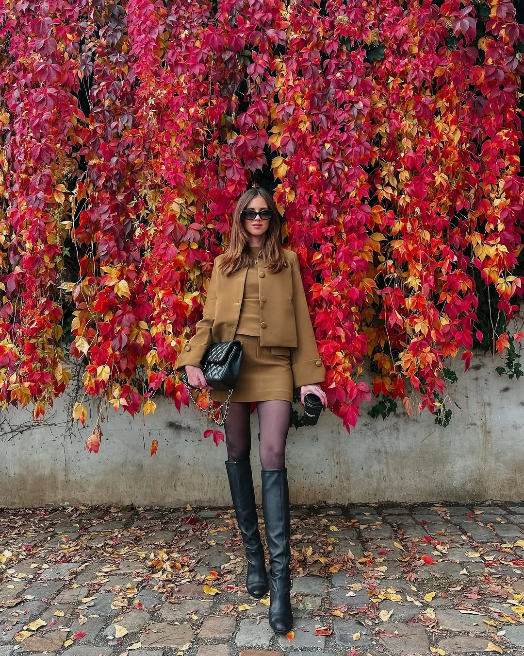 Camel cropped jacket and mini skirt with black knee-high boots