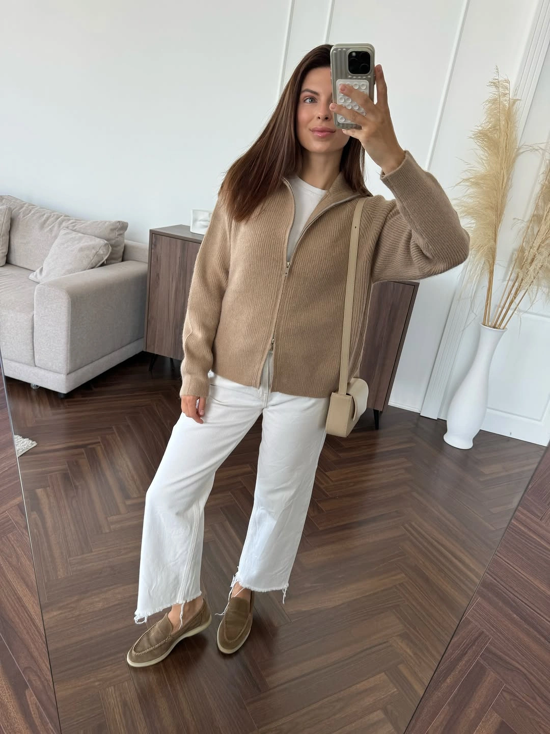Camel zip cardigan with cropped white jeans taupe slip-ons and cream bag