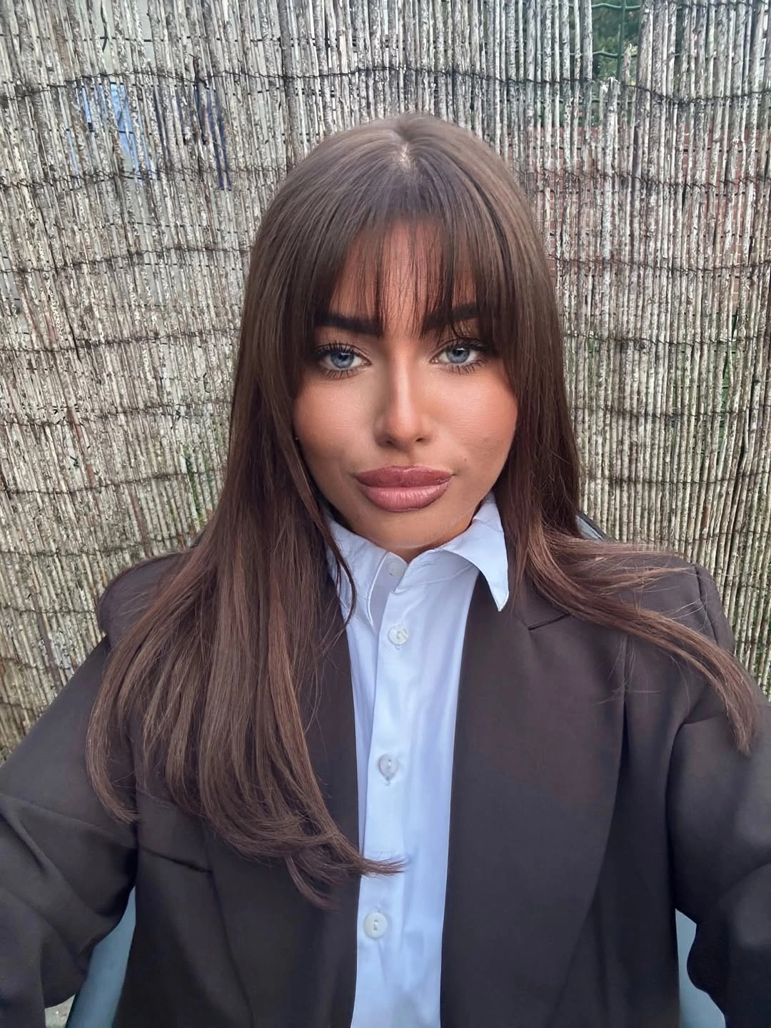 Soft medium-brown layers with wispy fringe and subtle warm tonal variation