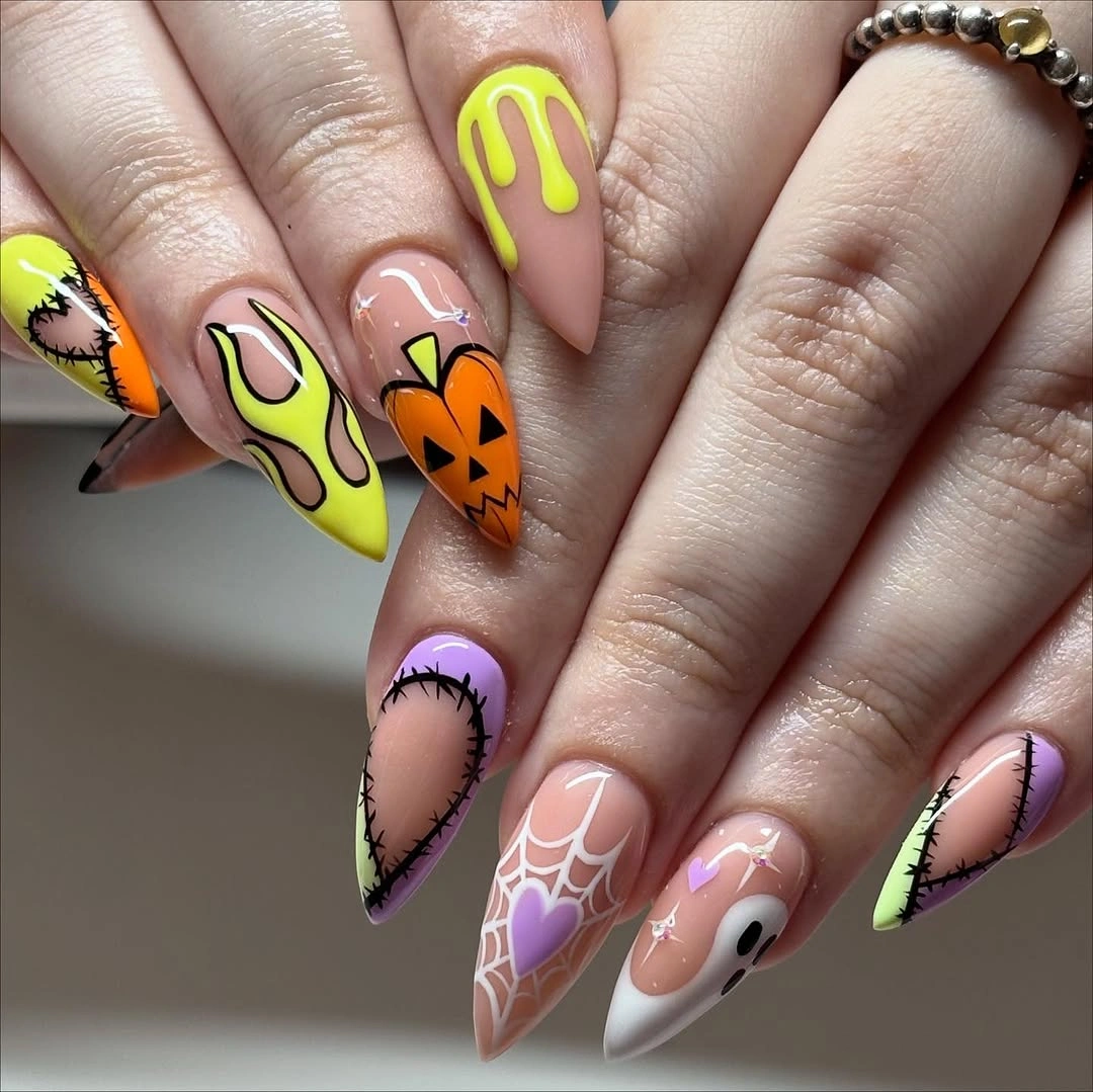 Long almond nails with neon yellow orange lavender and black Halloween outlines