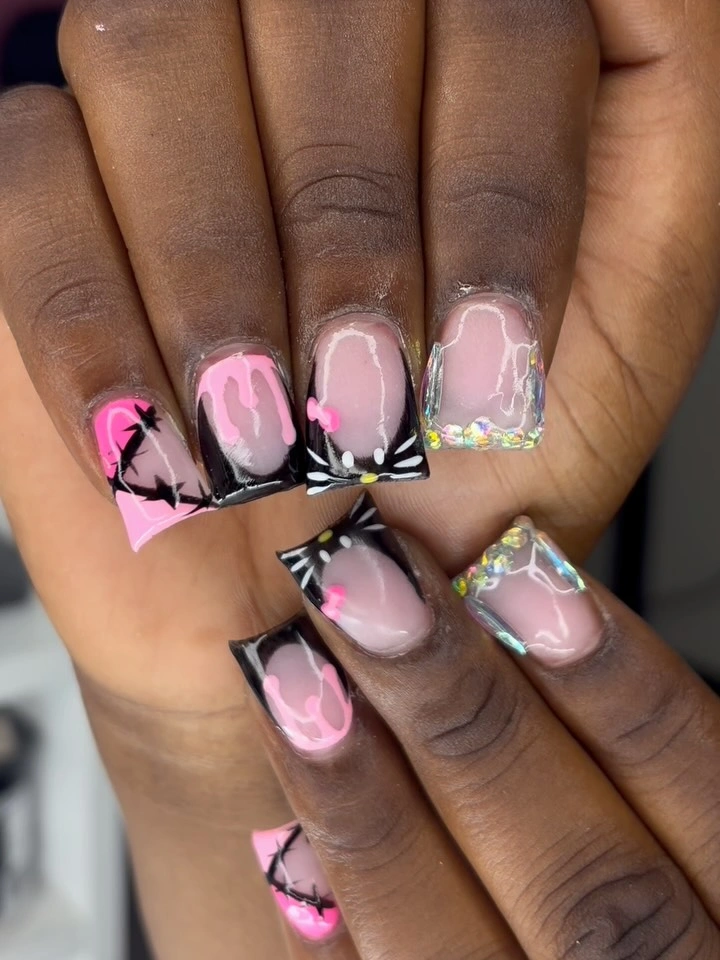 Long square pink and black flame nails with translucent reflective edges