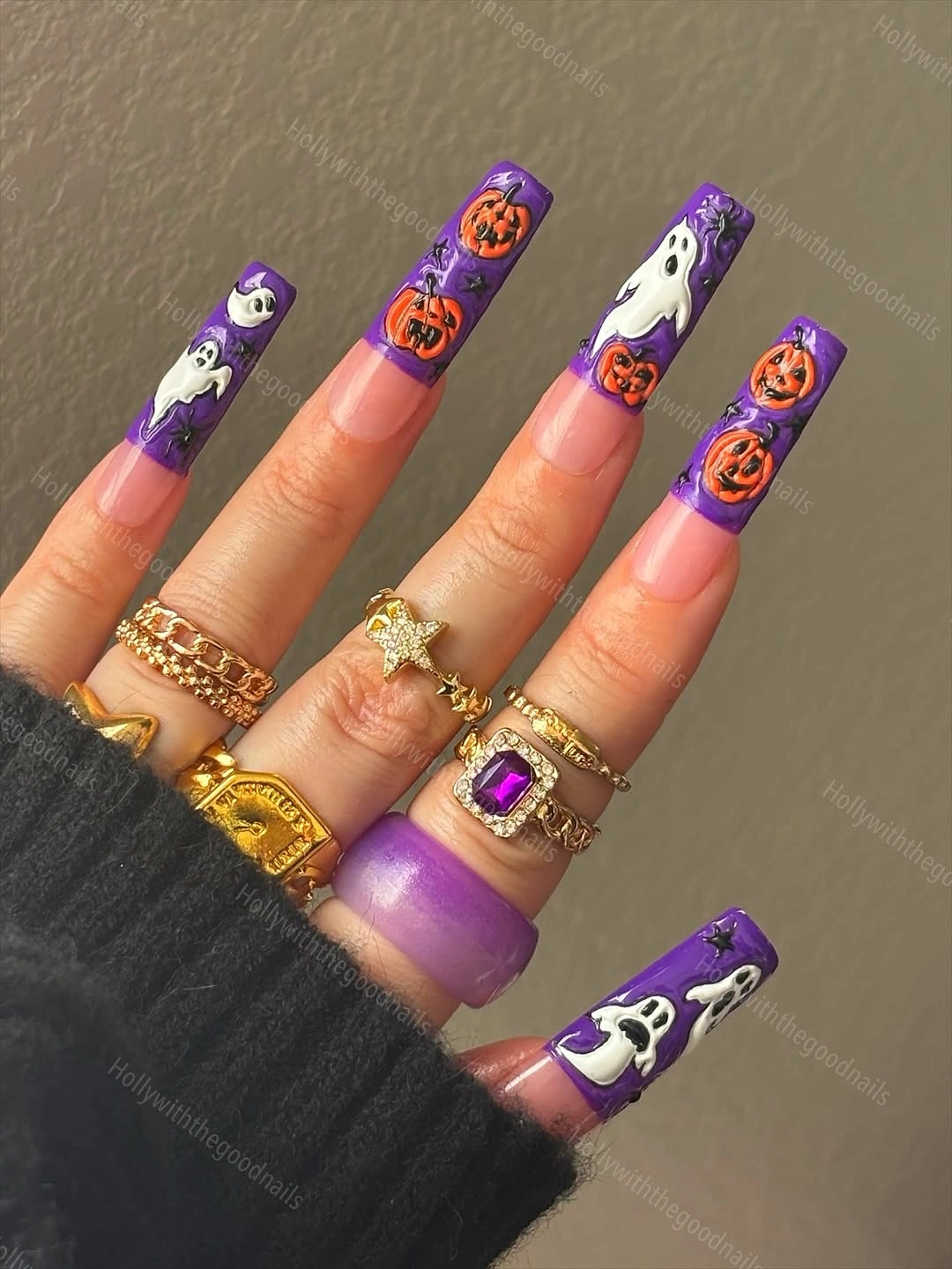 Long purple square nails with orange pumpkins and white ghost drawings