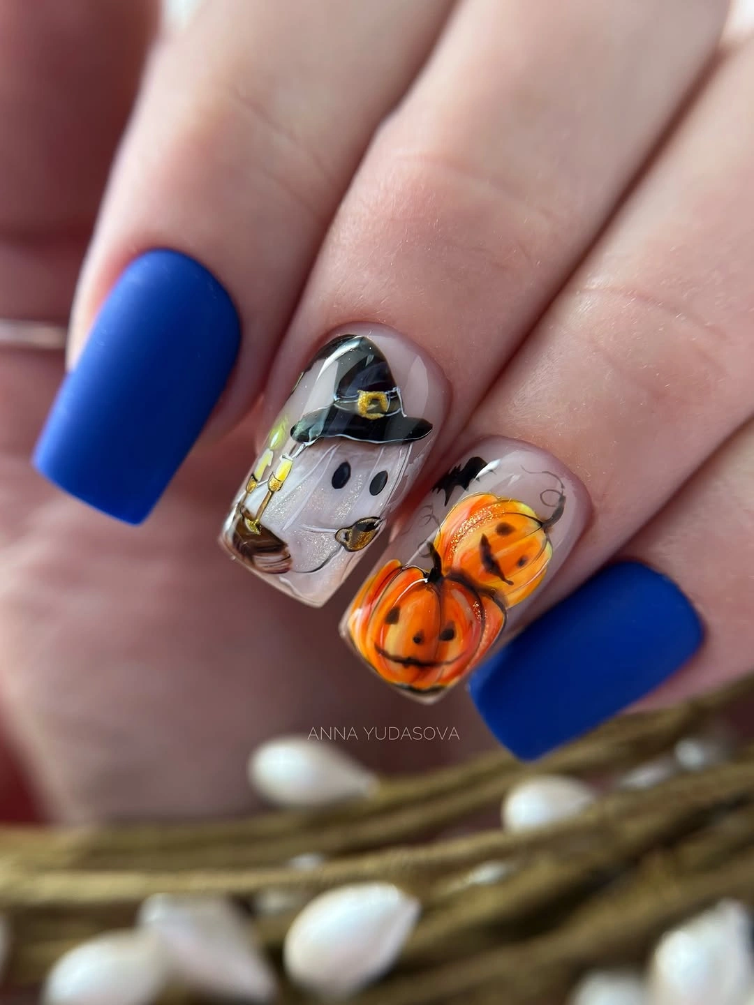 Short cobalt blue square nails with orange pumpkin and white ghost art