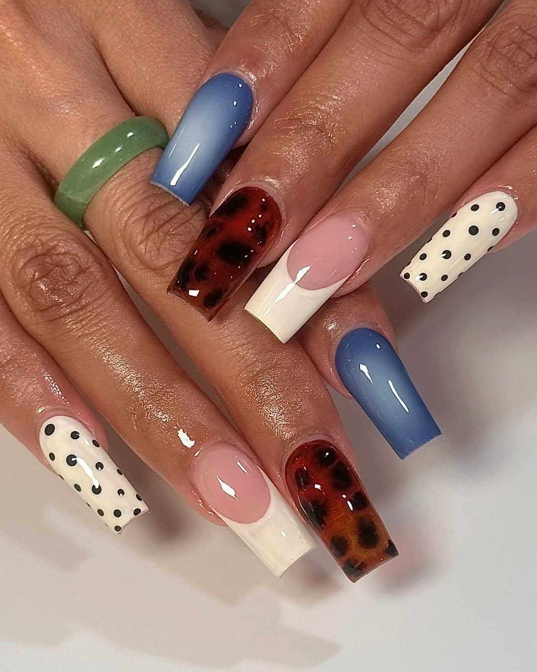 Long square mixed color nails with spotted and tortoiseshell panels