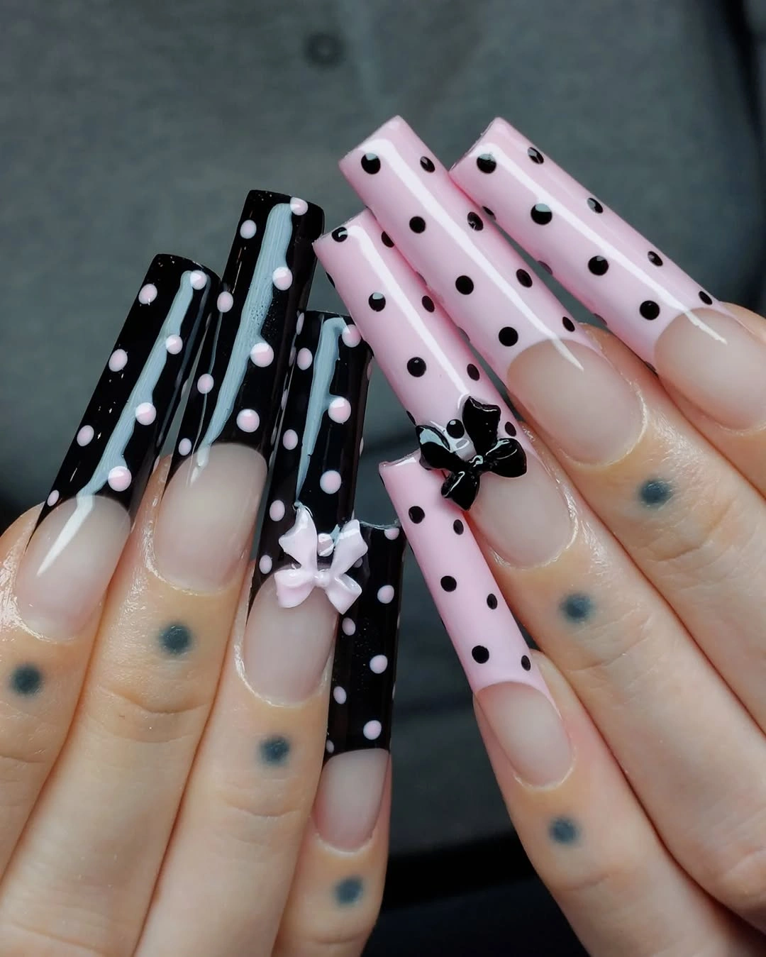 Long square black and pink polka dot nails with small bows