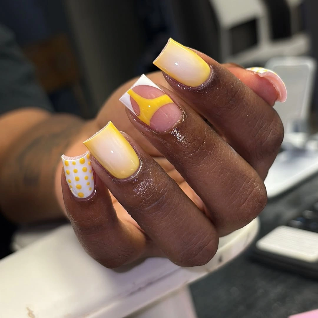 Short pastel yellow lavender and white accent nails