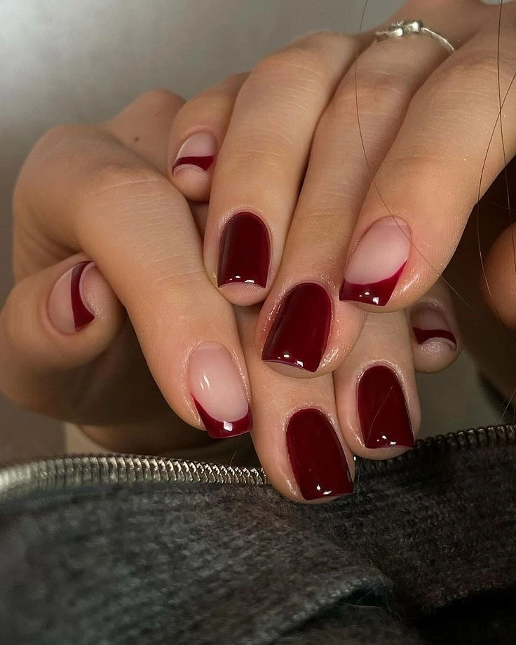 Short glossy burgundy nails with nude panels