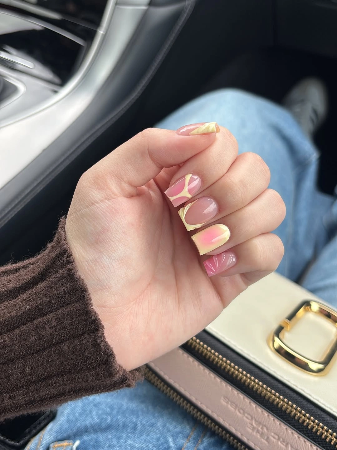 Short pink nails with yellow and lilac abstract blocks