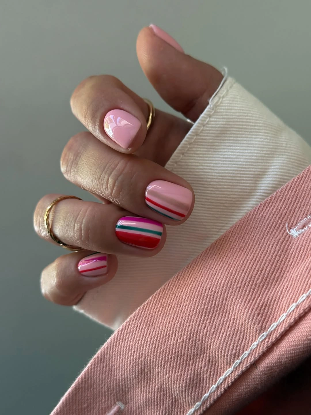 Short pink nails with red blue and white stripes