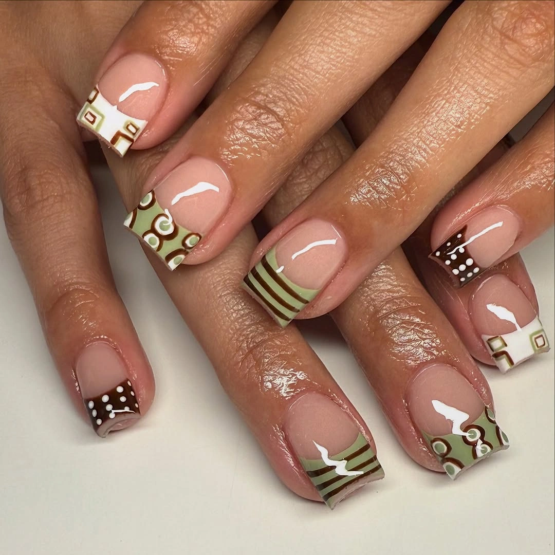 Short nude nails with olive white and fine linear accents