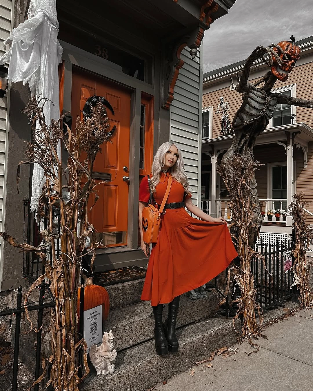 Burnt-orange maxi skirt with black top and black ankle boots for Halloween
