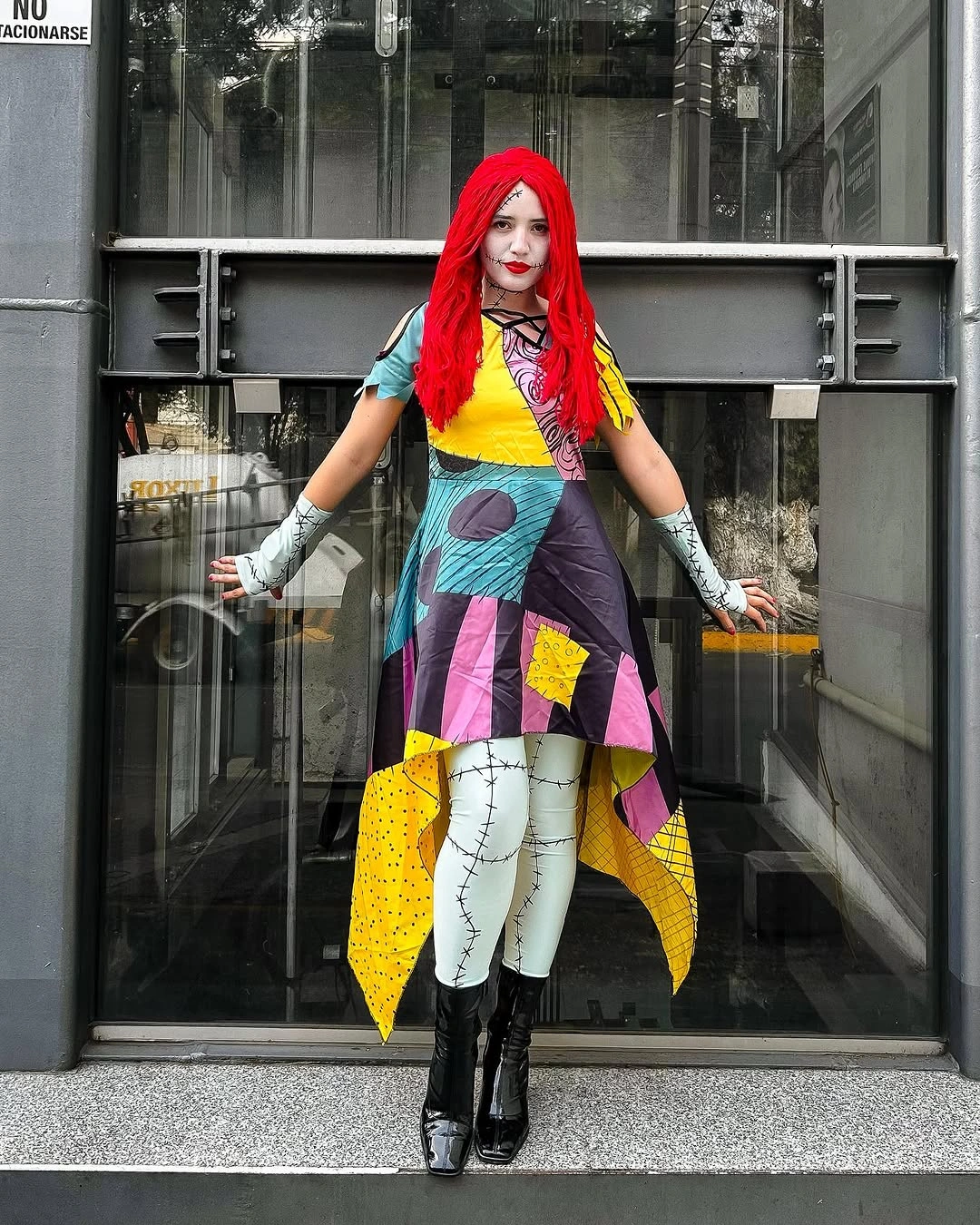 Colorful patchwork Halloween costume with red hair striped gloves and black boots