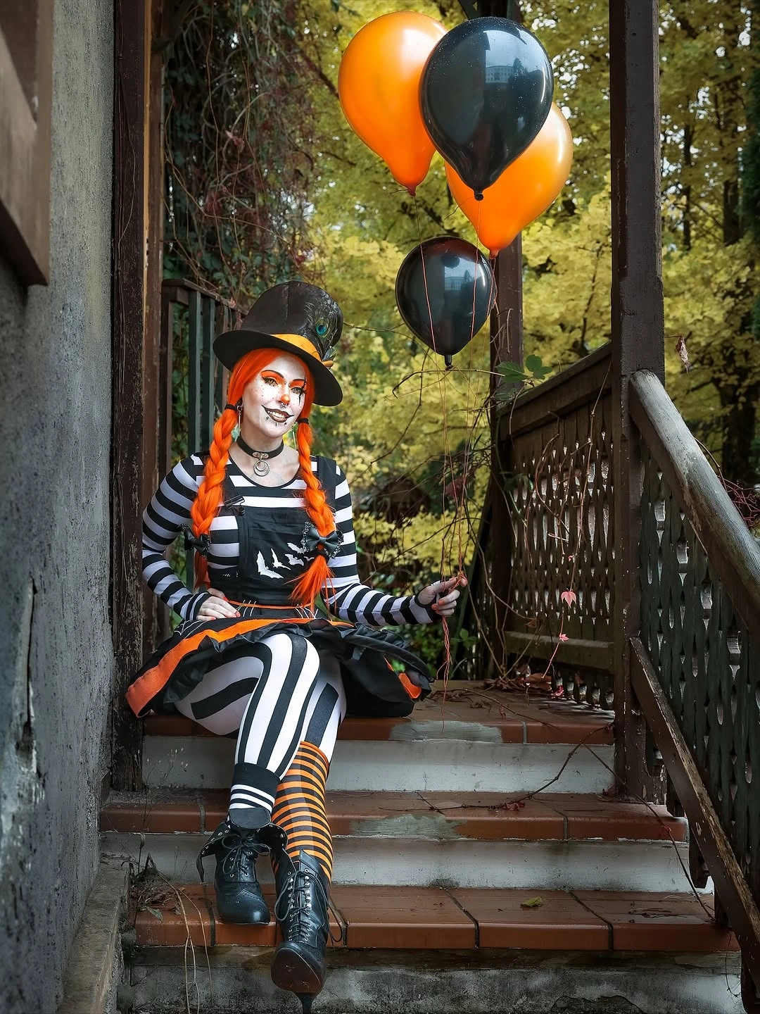 Orange wig Halloween outfit with black-and-white stripes orange-black dress and balloons