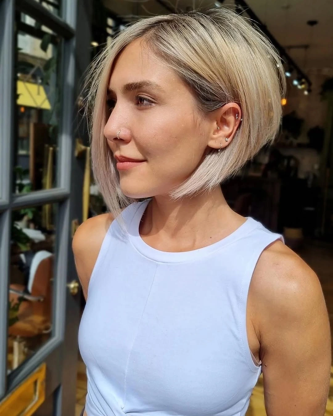 Pale blonde short angled bob with airy jaw-length front
