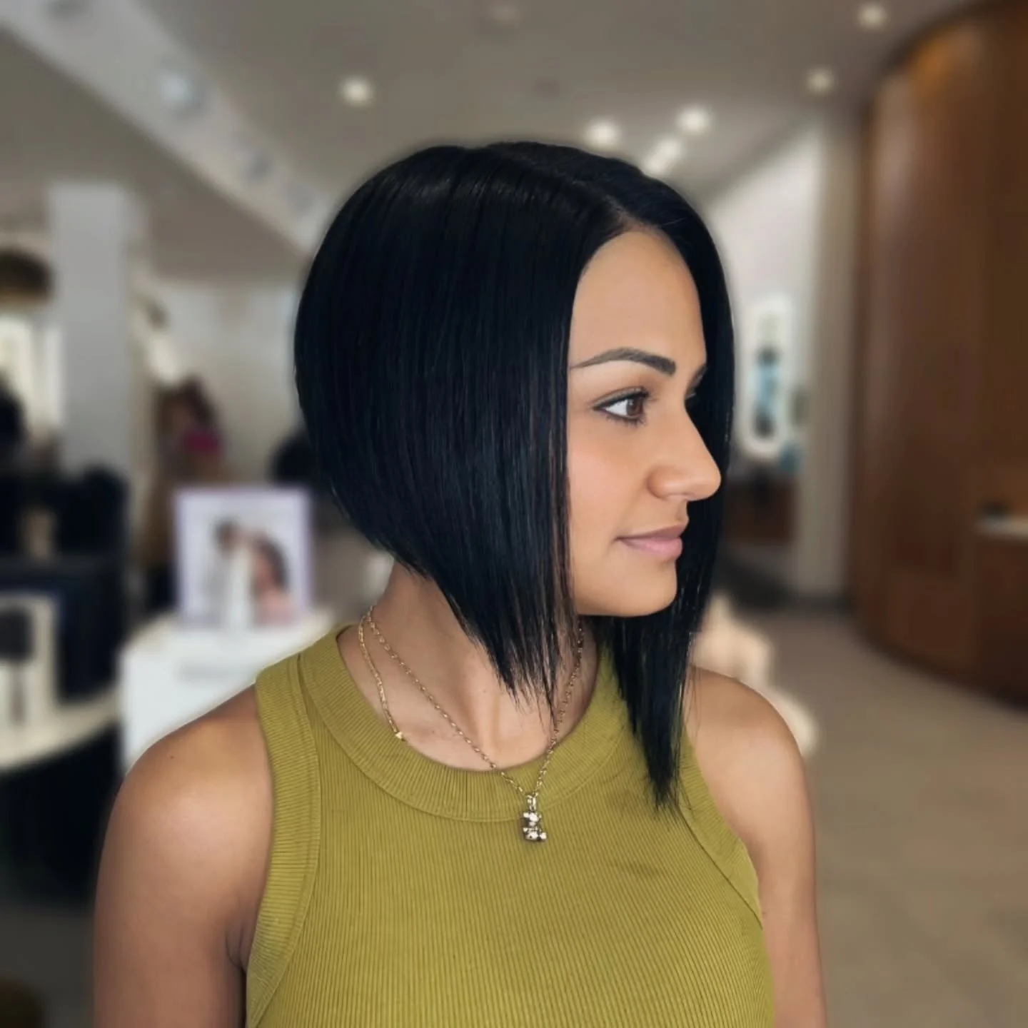 Sleek black angled bob with rounded back and long front point