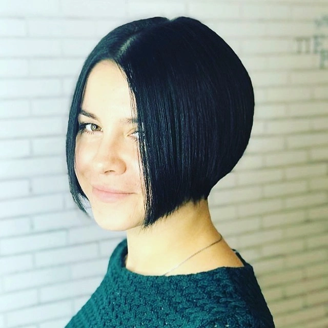 Compact dark A-line bob with side part and cropped back