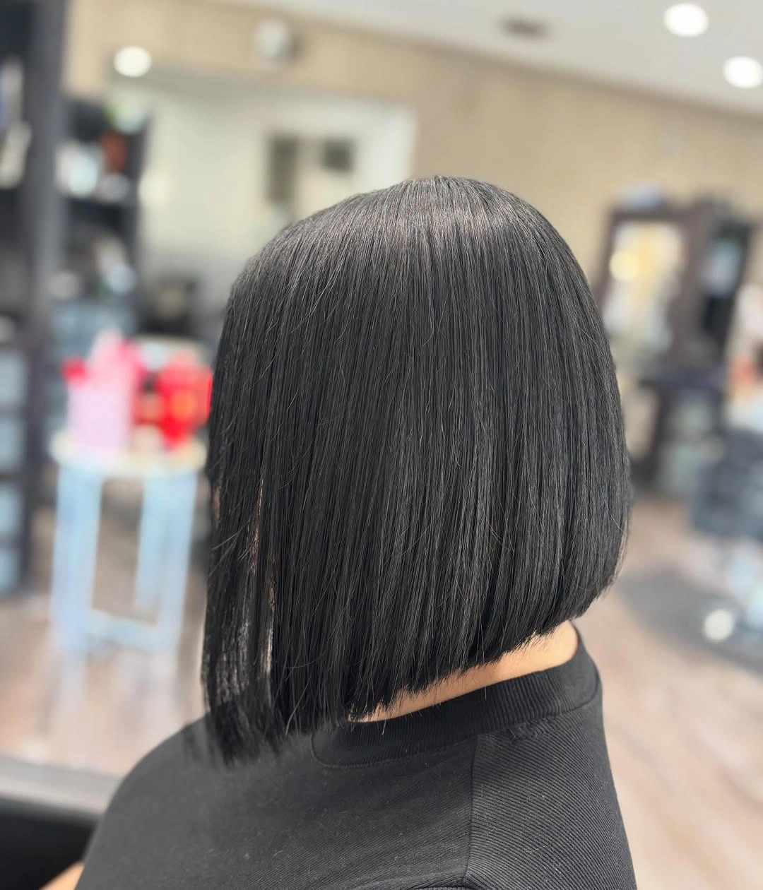 Rear view dark bob with rounded back and blunt nape