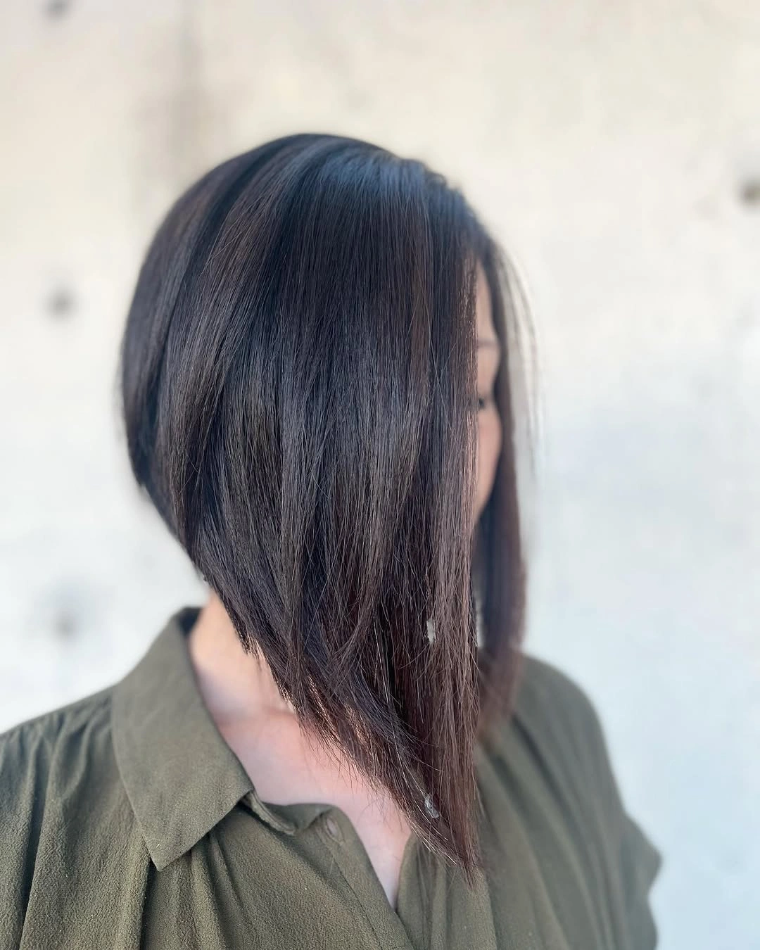 Dark longer A-line bob with side-swept front length