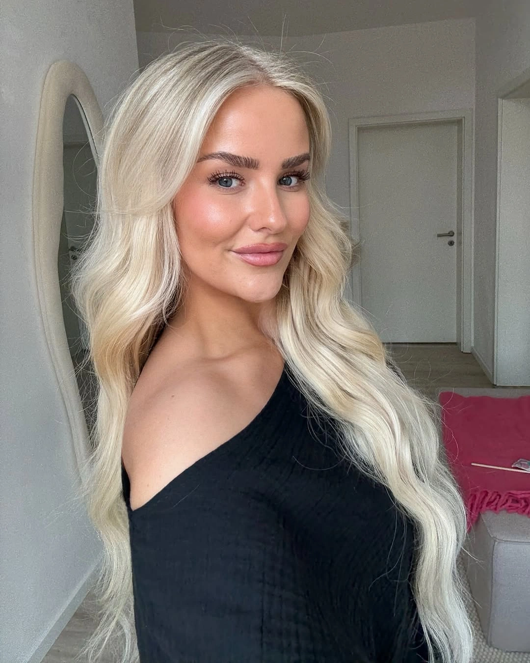 Long pale blonde hair with soft loose waves