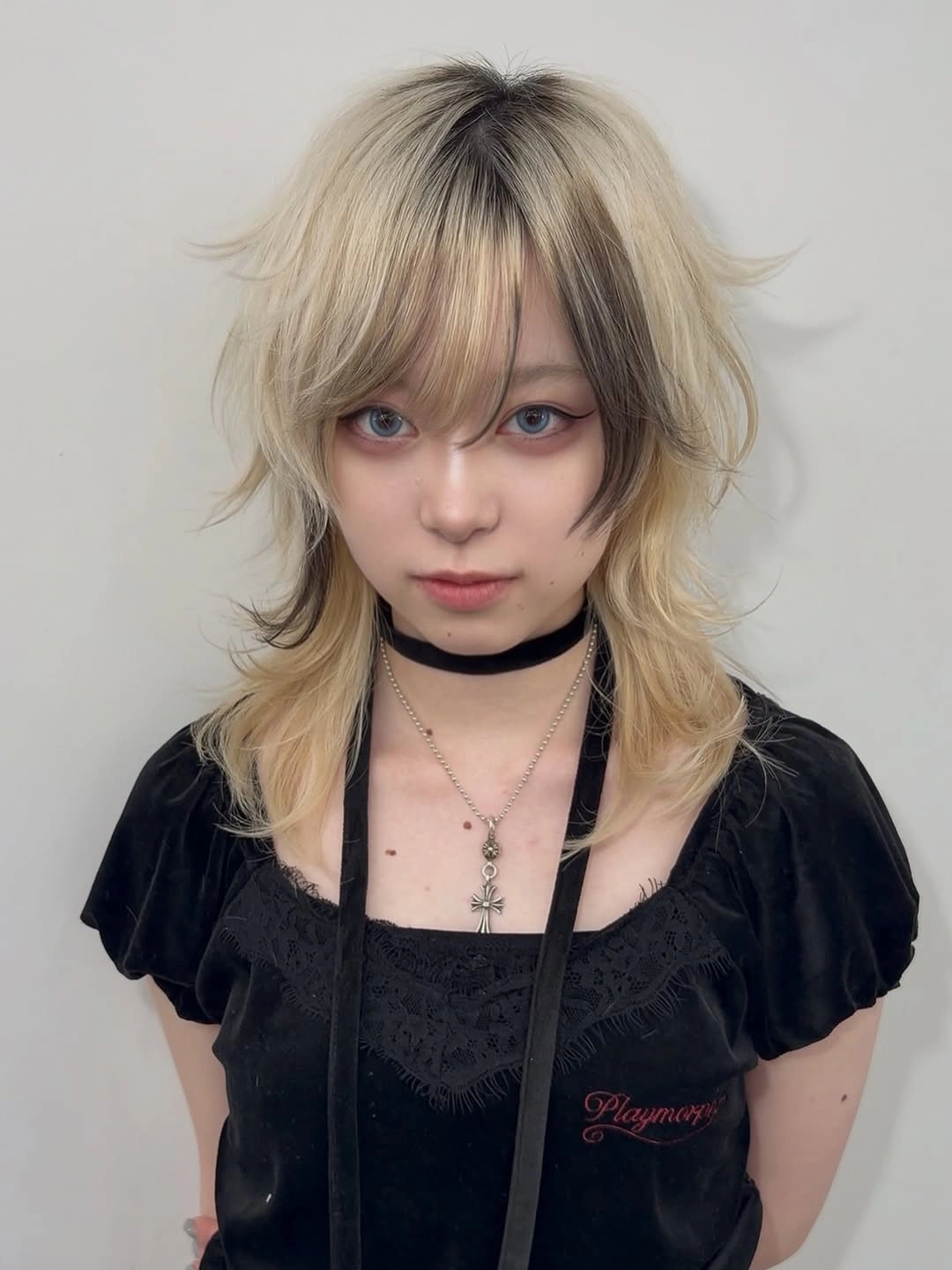 Short shaggy blonde hair with fringe and darker panels