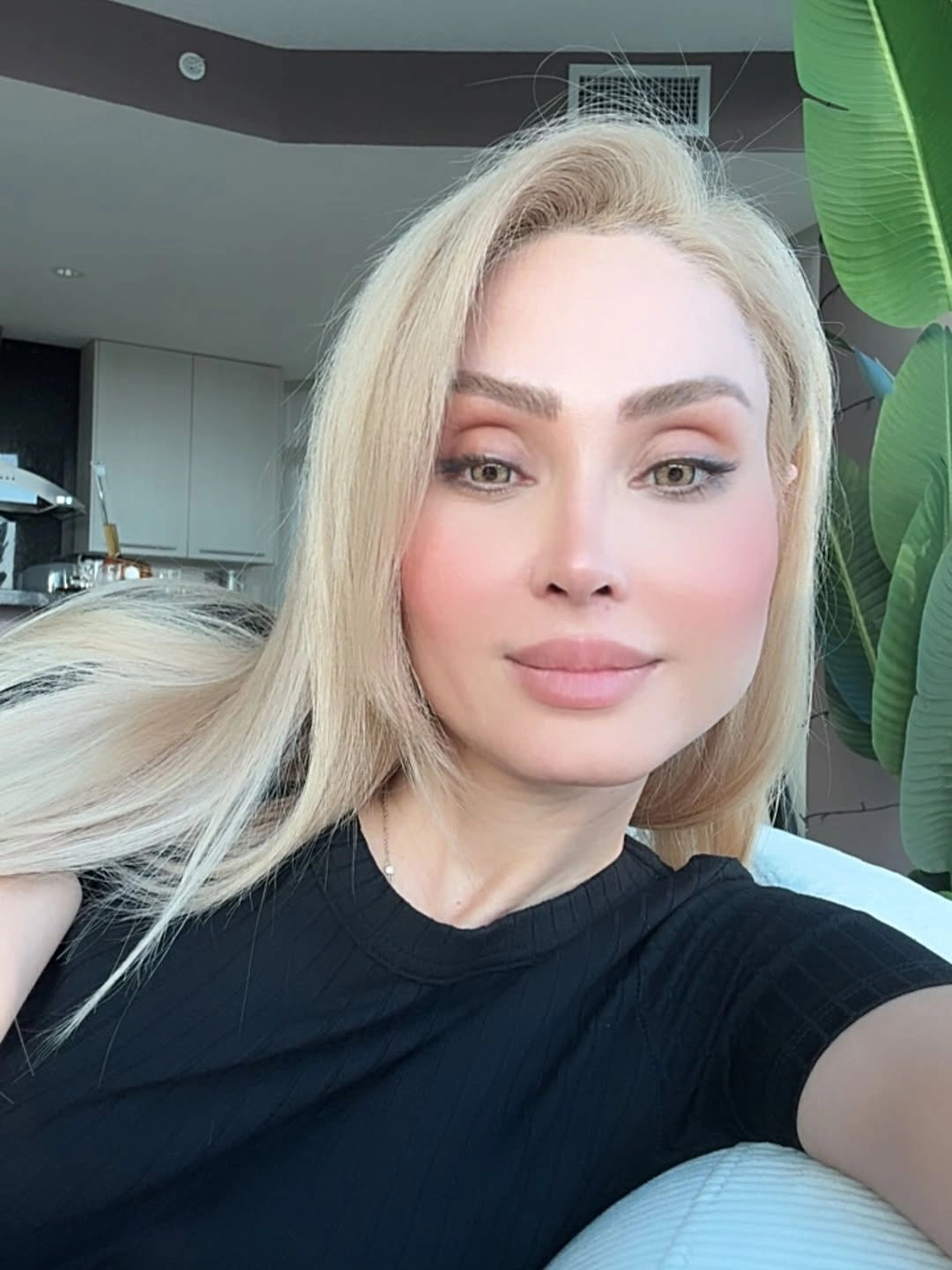Long pale beige blonde hair with smooth side-part styling