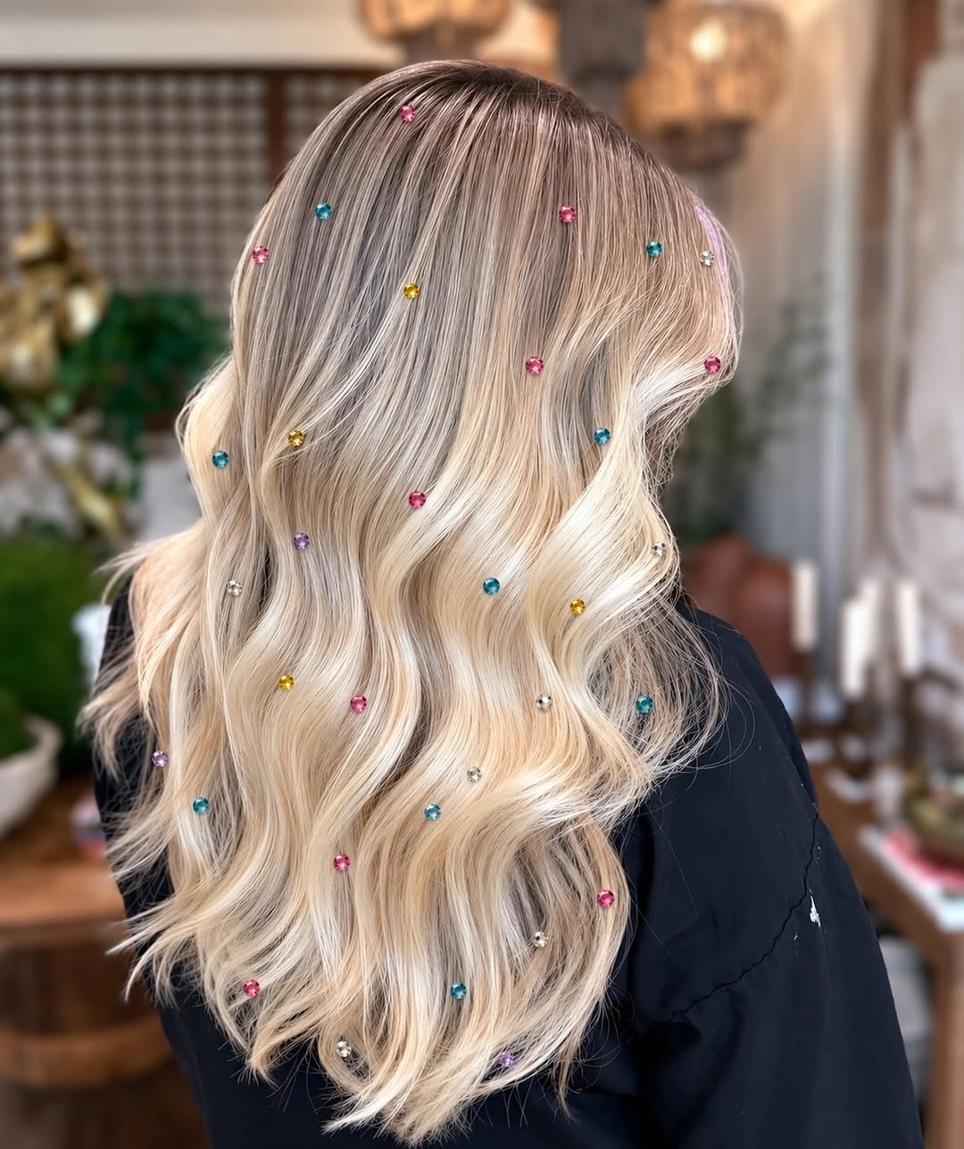 Long wavy blonde hair with colorful pin-like accents